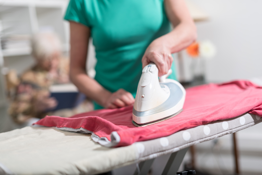 carer offering a domestic assistance service of ironing